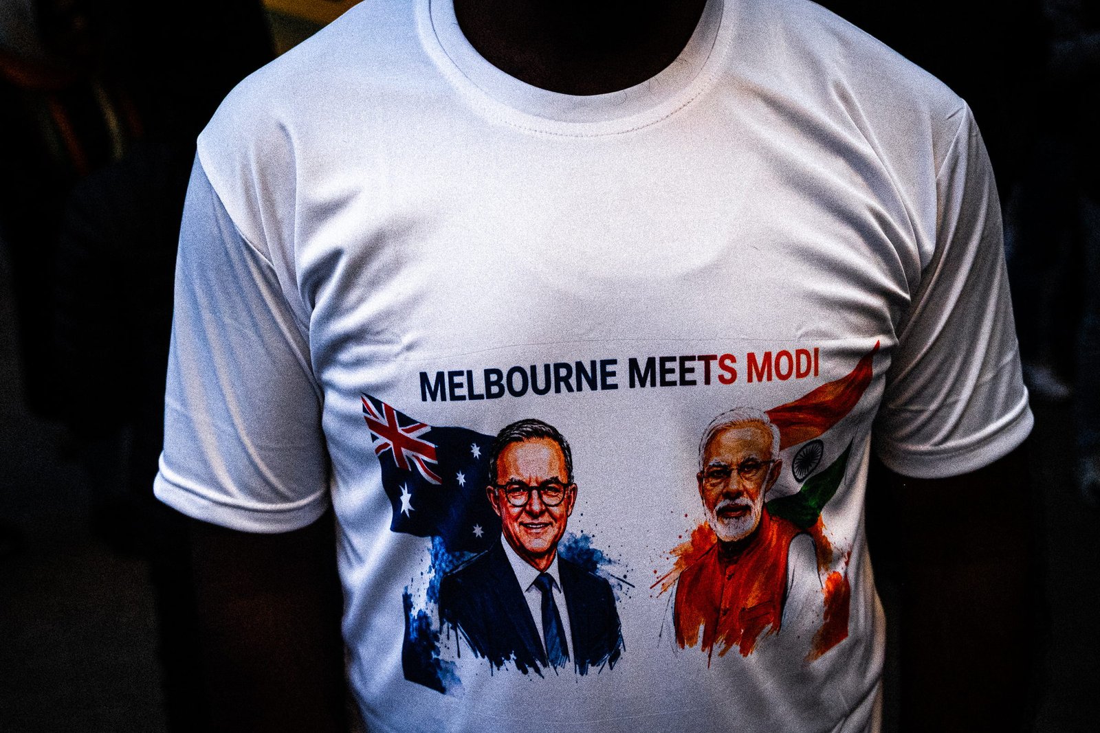 A Melbourne Meets Modi t-shirt photographed with the wearer's head cropped away